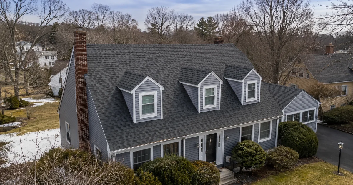 Completed asphalt roof replacement on a Massachusetts home