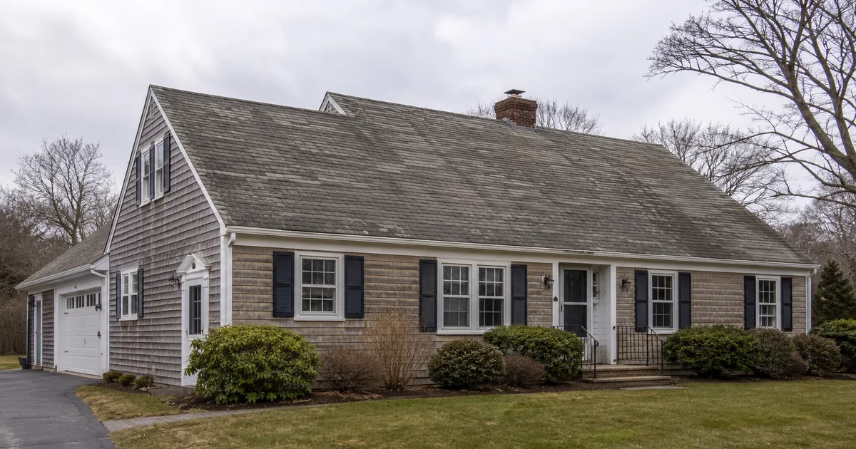 Worn asphalt roof on a Massachusetts home showing signs it needs replacement