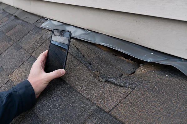 Storm-damaged flashing documented for a roof insurance claim