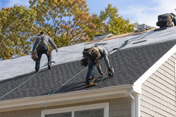 Powersol crew installing a GAF roof system on a new build in Worcester MA