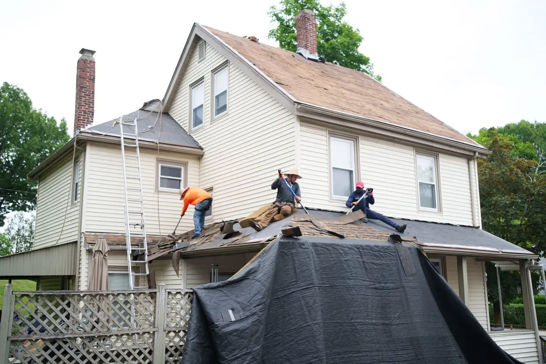 Emergency roof repair and tarping after a storm in Quincy MA