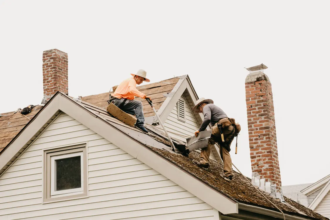 Roof repair replacing damaged shingles and flashing in Quincy MA
