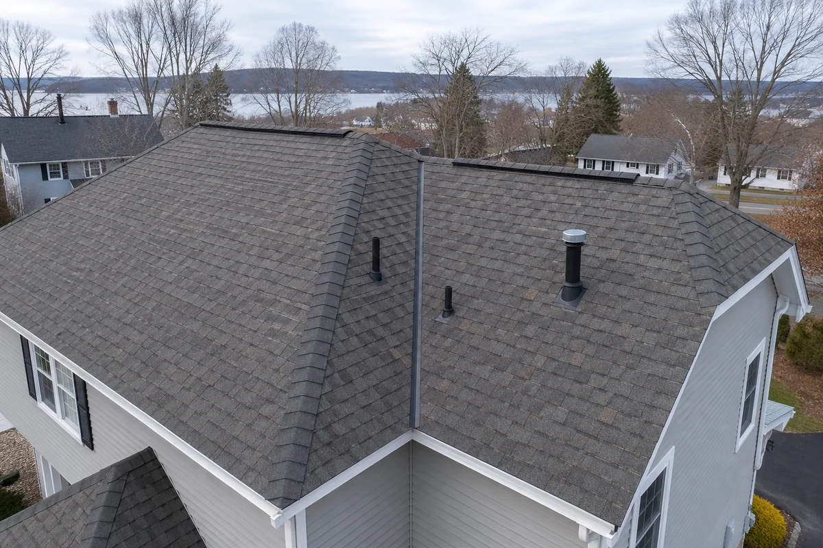 Massachusetts asphalt roof showing valleys and vents where leaks start