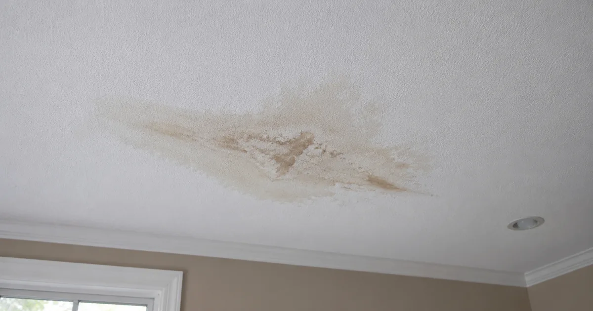 Ceiling water stain from a roof leak in a Worcester MA home