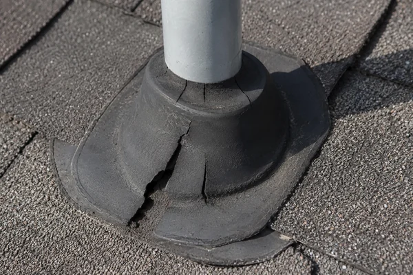 cracked pipe boot leaking around a plumbing vent