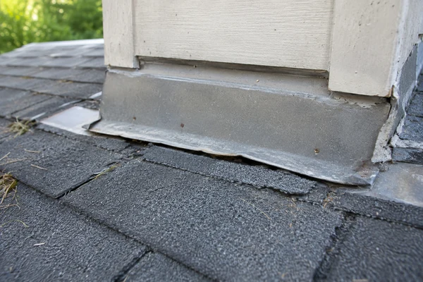 Cracked rubber pipe boot found during a roof inspection