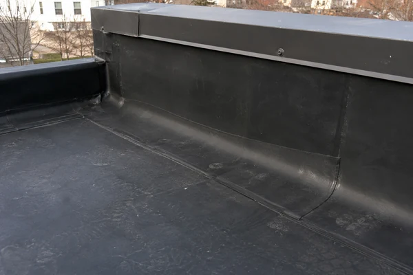 EPDM rubber membrane seam and flashing detail on a low-slope roof