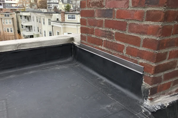 Parapet wall flashing on a Dorchester three-decker flat roof