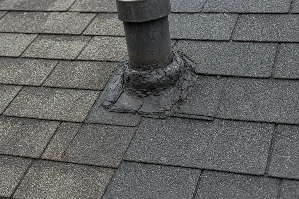 Roof inspection showing reused pipe boot after roof replacement