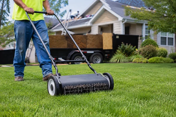 magnetic nail sweep across a lawn after a roof replacement