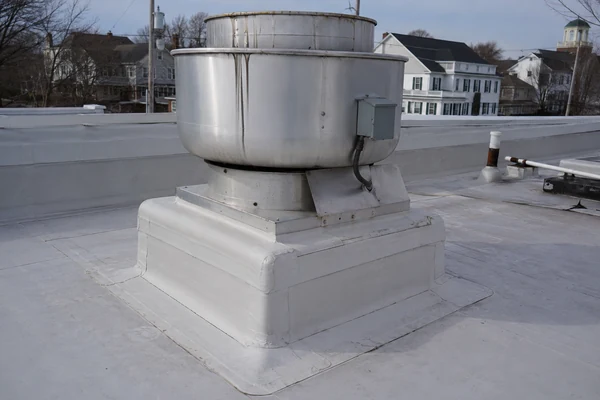 PVC roof membrane protected at a restaurant grease exhaust fan